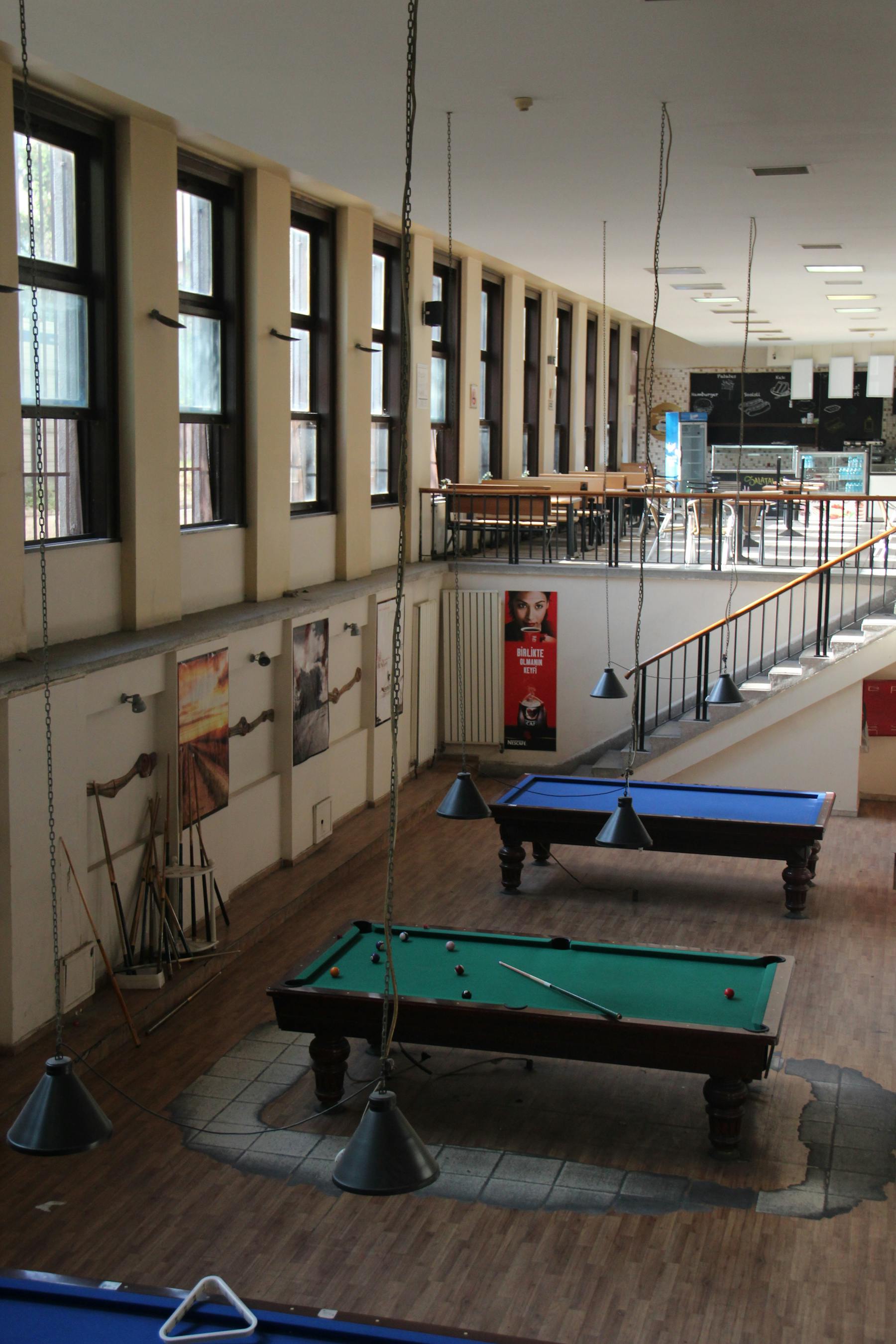 Billiards room with pool tables